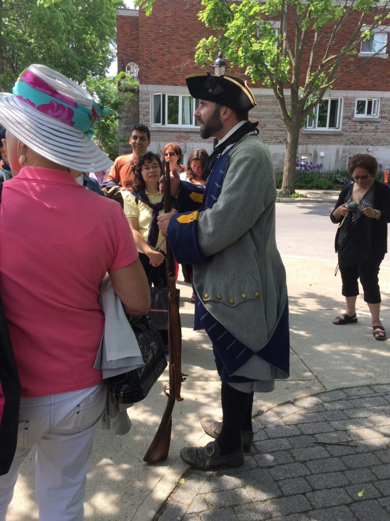 Volunteers portray residents from the early days of the colony.