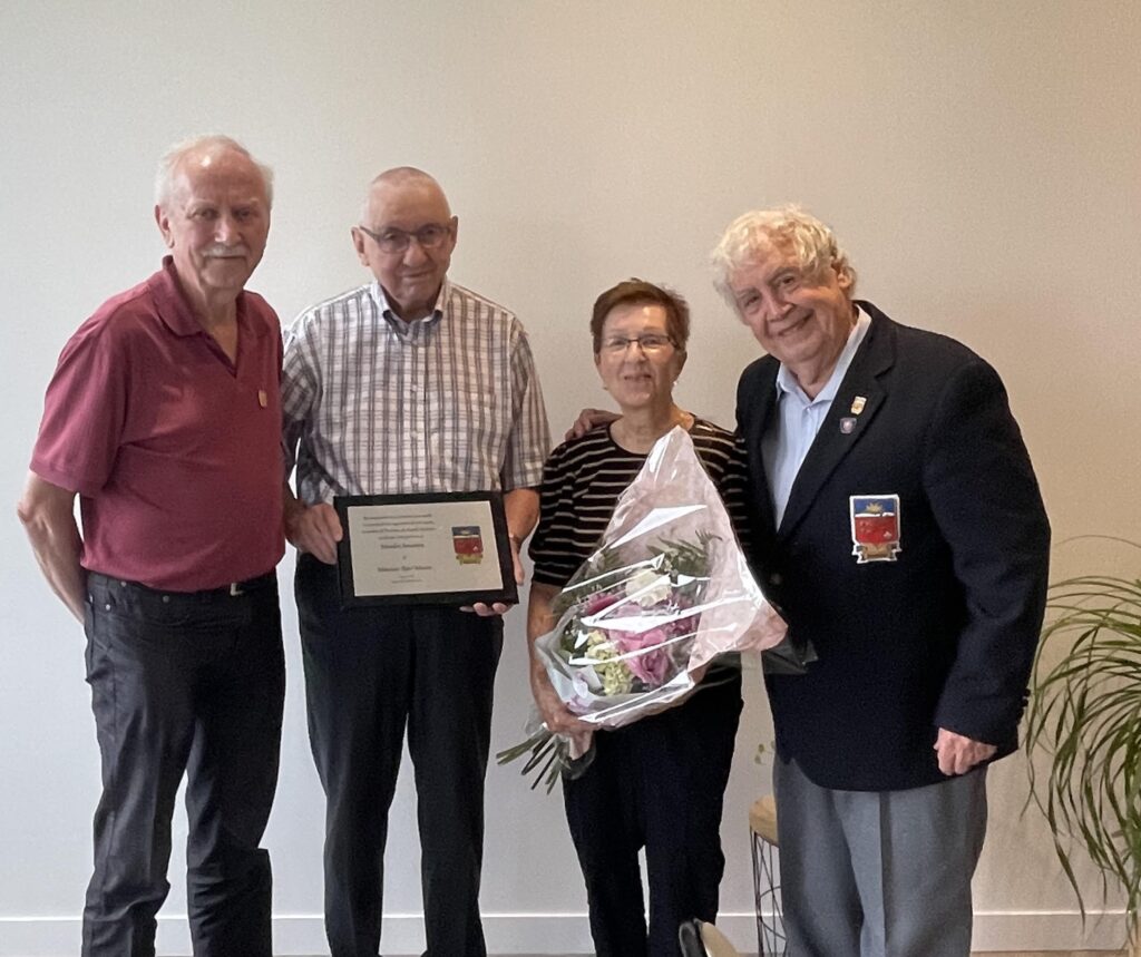 and flowers were presented to his partner, Michèle Desrosiers (M 105).