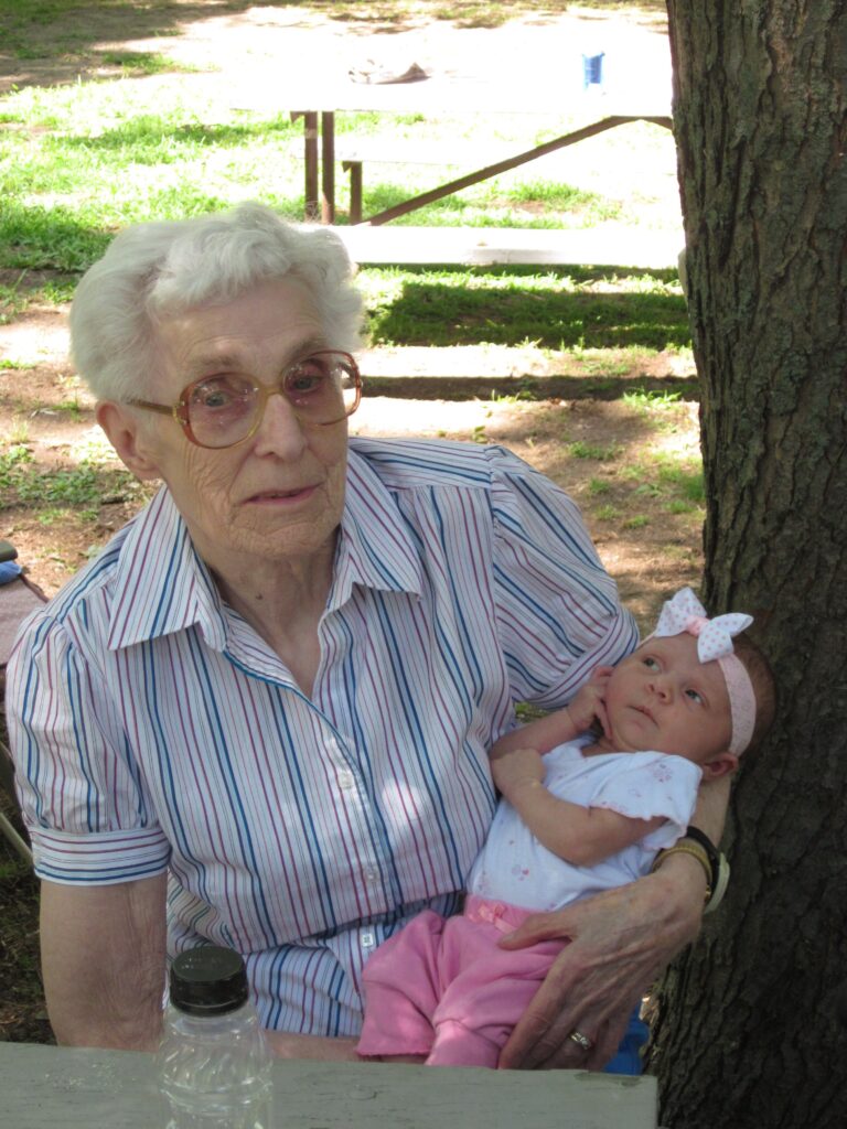 Five-week-old Gracie-Jean Mary Robar looks very comfortable in the arms of Rose Cross, her great-great-great-aunt.
Rose is the granddaughter of Edward Messier and Celina Touchette.